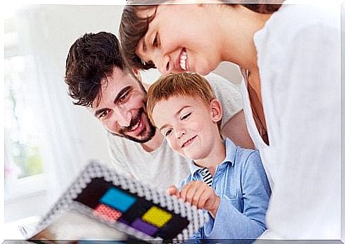 Parents looking at a photo album.