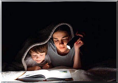 A mother and her son reading.