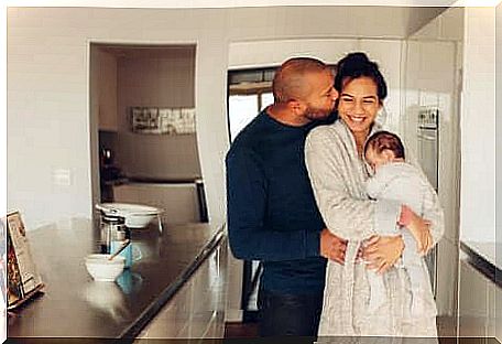 A family in the kitchen.