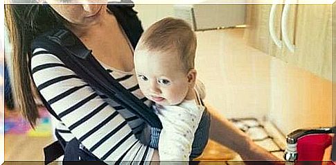 A baby in a baby carrier. 