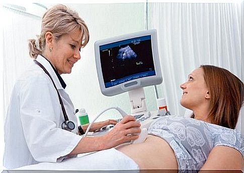 The baby's heartbeat can be heard using the portable fetal doppler device.