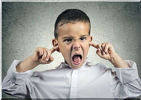 A child covering his ears