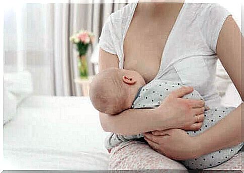 woman breastfeeding her baby