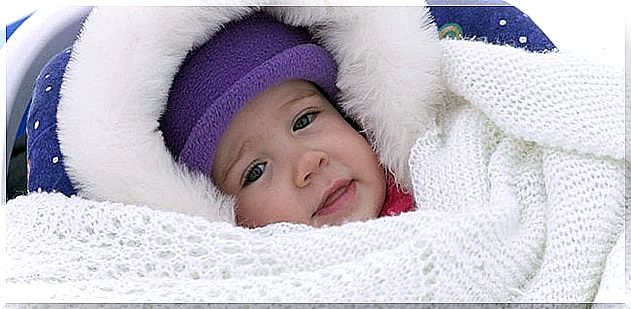 It is a good idea to cover the baby with several diapers to prevent him from catching a cold