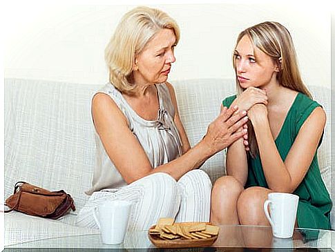 A mother and her daughter chatting