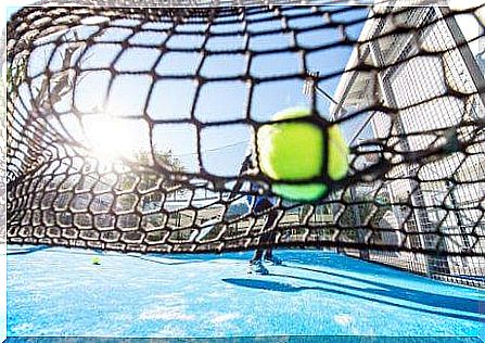 A padel ball in the net