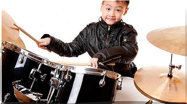 Child playing the drums