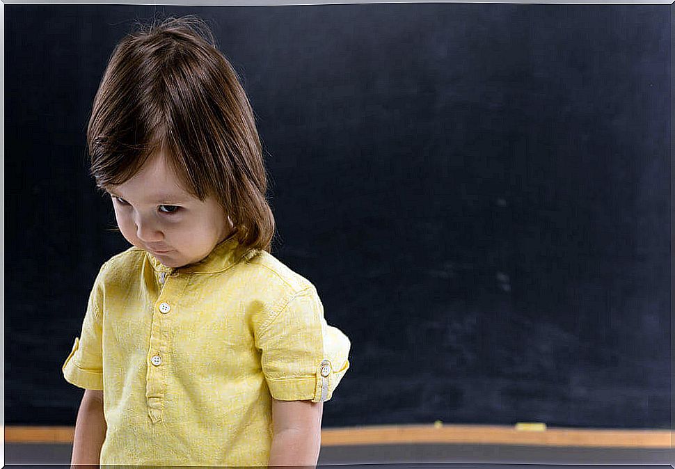 A shy young child at school. 