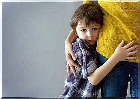 A child hugs his mother