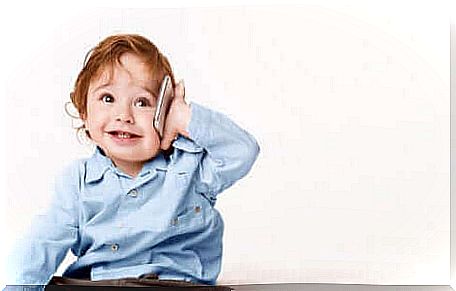 A child talking on the phone.