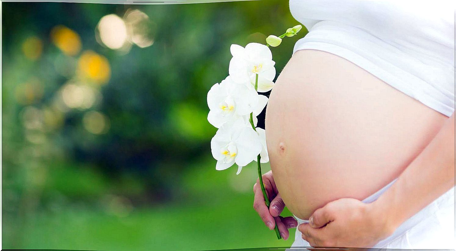 Pregnant belly with flowers.