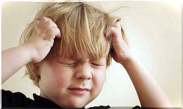 Little boy suffering from headache