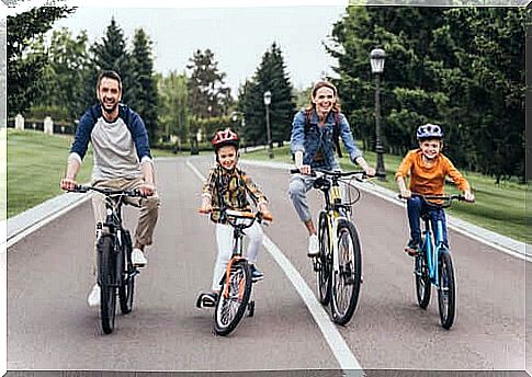 A family is riding a bicycle